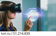 A user engages with virtual reality technology, reaching out to interact with digital elements in a contemporary indoor environment. Стоковое AI-видео, аниматор Данила Большаков / Фотобанк Лори