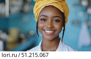 A young woman beams with happiness, showcasing her vibrant personality in a cheerful kitchen environment filled with colorful decor and utensils. Стоковое AI-видео, аниматор Данила Большаков / Фотобанк Лори