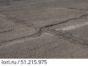 Cracked Asphalt Pavement Caused by Subgrade Failure and Inadequate Geotechnical Survey. Стоковое фото, фотограф Дмитрий Коростылев / Фотобанк Лори
