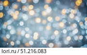 Abstract christmas background with gold and blue bokeh lights, festive holiday texture with sparkling glitter for new year celebration, winter magic concept. Стоковое AI-изображение, AI-художник Павел Муравьев / Фотобанк Лори