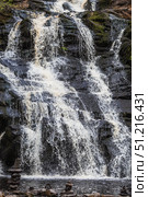 Yukankoski Waterfall (White Bridges) in the Republic of Karelia on a summer evening, Russia. Стоковое фото, фотограф Photojuli / Фотобанк Лори