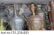 Vintage metal pitchers, pots, and jugs on wooden shelves Antique copper kitchenware at a traditional market Antique copper jug ​​on white background a group of five copper glazed jugs Cutout and isolated and transparent background image Elegant antique jugs and vases a collection of exquisite pottery Antique copper jug placed on an old wooden shelf, surrounded by vintage decor in a cozy living room. Стоковое видео, видеограф Zita Khasanova / Фотобанк Лори