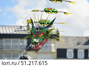 Kite festival. Dragon kite in the sky. Стоковое фото, фотограф Irina Kuchugurina/Gaudy / Фотобанк Лори