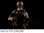 Special operations forces soldier wearing mask, armed with submachine gun, on black background. Oleg Zabielin / Stocktrek Images/TASS. Стоковое фото, агентство ТАСС / Фотобанк Лори