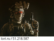 Studio portrait of soldier wearing a mask, helmet with night vision device, and armed with service pistol. Oleg Zabielin / Stocktrek Images/TASS. Стоковое фото, агентство ТАСС / Фотобанк Лори