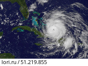 Satellite view of the eye of Hurricane Irene as it enters the Bahamas. Stocktrek Images, Inc./TASS (2011 год). Стоковое фото, агентство ТАСС / Фотобанк Лори