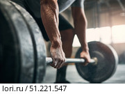 Muscular hands clenching barbell, chalk covered fingers revealing strength, intensity radiating during weightlifting training session. Стоковое AI-изображение, AI-художник Юрий Поздников / Фотобанк Лори