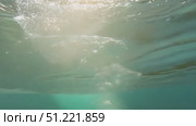 Underwater scene showing green liquid depth, bubbling upward with white foam, generating rippling surface patterns under soft natural illumination. Стоковое AI-видео, аниматор Юрий Поздников / Фотобанк Лори