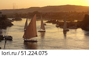 felucca boats on Nile river in Aswan at sunset. Стоковое фото, фотограф Михаил Коханчиков / Фотобанк Лори