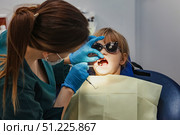 Bright Smiles and Gentle Hands at a Pediatric Dental Appointment for Young Patients. Стоковое фото, фотограф Aleksandr Golubev / Фотобанк Лори