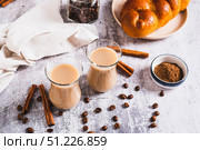 Yemeni coffee with spices and cream in glasses and crispy bread on the table. Стоковое фото, фотограф Елена Руй / Фотобанк Лори