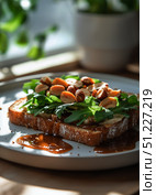 Delicious Open-Faced Sandwich Topped With Greens and Nuts on a Wooden Table in Natural Light. Стоковое AI-изображение, AI-художник Юлия Гапеенко / Фотобанк Лори