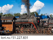 An old Soviet steam locomotive of the L series. The Ruskeala Express retro train is at the Sortavala station. Russia, Republic of Karelia, Sortavala, August 12, 2025. Редакционное фото, фотограф Photojuli / Фотобанк Лори