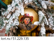 A decorated Christmas tree of the Mosfilm film company with portraits of actors from popular Soviet films, in the GUM store in the center of Moscow. Russia, Moscow, January 9, 2025. Редакционное фото, фотограф Photojuli / Фотобанк Лори