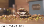 Dubai chocolate with vibrant green pistachio. Стоковое видео, видеограф Mihail Mihaylov / Фотобанк Лори
