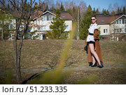 Fashionable model poses confidently in urban outdoor setting during sunny day. Стоковое фото, фотограф Кривошеина Елена Леонидовна / Фотобанк Лори