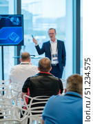 Business seminar with attendees listening to speaker in a modern conference room. Стоковое фото, фотограф Антон Гвоздиков / Фотобанк Лори