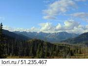 A Breathtaking Mountain Landscape Under a Clear Blue Sky Above. Стоковое фото, фотограф Igor Bastrakov / Фотобанк Лори