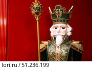 The Nutcracker on the New Year's tree in Moscow. New Year's card 2026. Beautiful Christmas background. Concept of preparing decorations and attire for the New Year. Стоковое фото, фотограф Photojuli / Фотобанк Лори
