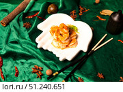 Golden Shrimp Shines on a White Hand Dish in a Sophisticated Still Life. Стоковое фото, фотограф Aleksandr Golubev / Фотобанк Лори