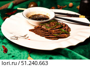 Journey of Flavor a Spiced Shank Dish at a Restaurant in China. Стоковое фото, фотограф Aleksandr Golubev / Фотобанк Лори
