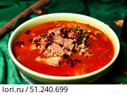 Spicy Sichuan Beef and Chili Soup in a Green Bowl at a Chinese Eatery. Стоковое фото, фотограф Aleksandr Golubev / Фотобанк Лори