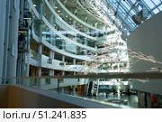 A Modern Architectural Marvel Showcasing Innovative Design, Open Spaces, and Natural Light Enhanced by Artistic Installations in a Contemporary Building. Стоковое фото, фотограф Владимир Федоров / Фотобанк Лори