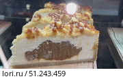 Indulge in these incredibly smooth and rich cheesecake slices, which are simply perfect for dessert lovers. Стоковое видео, видеограф worker / Фотобанк Лори