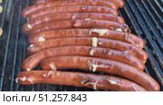 Sizzling German Bratwurst Sausages Grilling to Perfection. Стоковое видео, видеограф Sergakoff / Фотобанк Лори