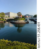 Nagasaki, Japan - May 12, 2025. Small Island with Building and Tree. Стоковое фото, фотограф Константин Никитеев / Фотобанк Лори