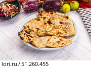 Indian stuffed potato bread Paratha. Стоковое фото, фотограф Андрей Старостин / Фотобанк Лори