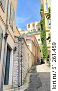 Galata Tower in Istanbul, view from the narrow street Narrow street with Galata Tower and historic building in Beyoglu district, Istanbul, Turkey Beautiful view of city street with different stores. Редакционное фото, фотограф Zita Khasanova / Фотобанк Лори