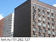 Facades of houses in the  new microdistrict called Buninskie Lugy ("BUNIN'S MEADOWS" HOUSING COMPLEX) of August 16, 2025, in Moscow, Russia. Стоковое фото, фотограф Ирина Вершинская / Фотобанк Лори