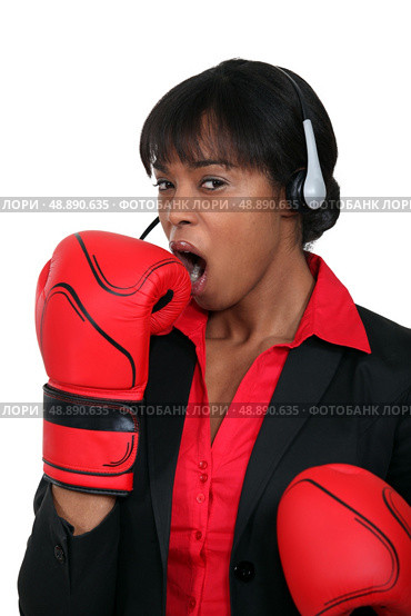 A black businesswoman yawning. Стоковое фото, агентство Ingram Publishing / Фотобанк Лори