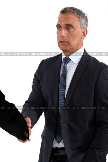 A business handshake. Стоковое фото, агентство Ingram Publishing / Фотобанк Лори
