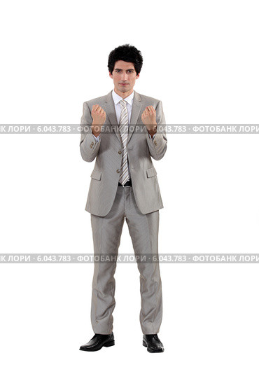 A businessman in a fighting stance. Стоковое фото, фотограф Phovoir Images / Фотобанк Лори