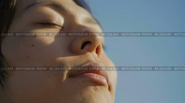 A close-up shot of a person with their eyes shut, showing the peacefulness of their expression. Стоковое AI-изображение, AI-художник Данила Большаков / Фотобанк Лори