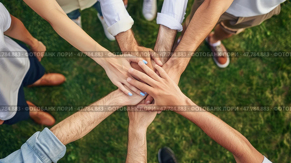 A group of diversified individuals standing in a circle, joining their hands together in unity and teamwork. Стоковое AI-изображение, AI-художник Данила Большаков / Фотобанк Лори