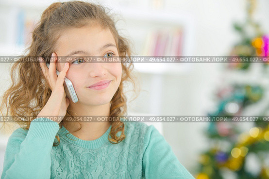 a happy child on the phone. Стоковое фото, агентство Ingram Publishing / Фотобанк Лори