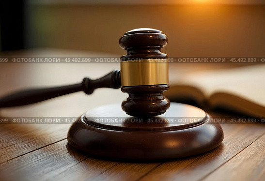 A judge's hammer with a wooden stand and an open book in the background. Стоковое AI-изображение, AI-художник RamA / Фотобанк Лори
