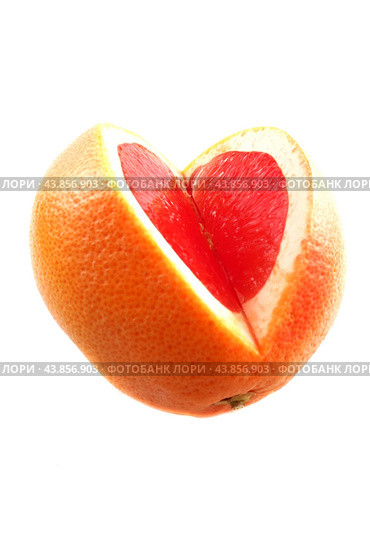 A large grapefruit with a cut-out part on a white background. Стоковое фото, фотограф Ярославский Максим / Фотобанк Лори