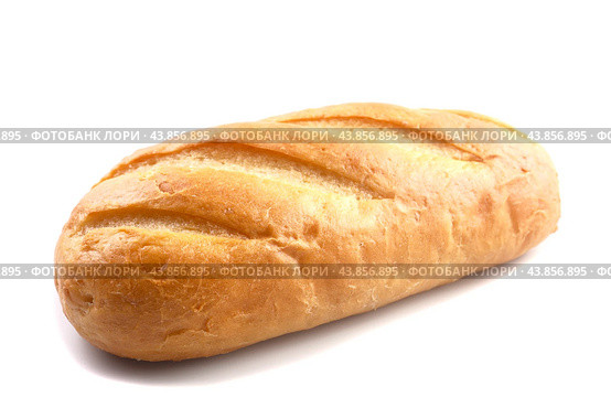 A loaf of fresh wheat bread on a white background. Стоковое фото, фотограф Ярославский Максим / Фотобанк Лори