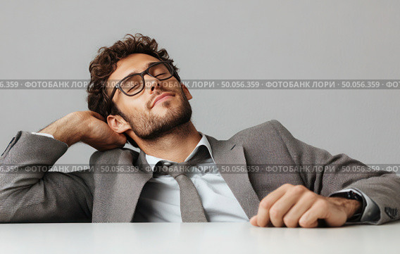 A man in a suit is sleeping on a table. Стоковое фото, фотограф Ярославский Максим / Фотобанк Лори