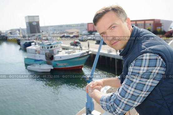 a man is on quayside. Стоковое фото, агентство Ingram Publishing / Фотобанк Лори