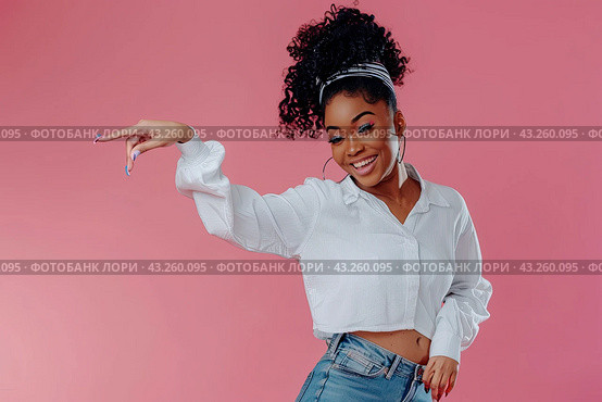 A photo of an excited woman in jeans and a rumpled shirt, standing full-length on a pink background and pointing her finger to the side. Стоковое AI-изображение, AI-художник Ярославский Максим / Фотобанк Лори