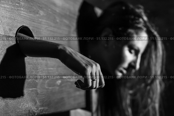A redhead woman is imprisoned in a wooden pillory during sex games. BDSM Erotic fantasies.Subordination. Toys for adults. colorless. Стоковое фото, фотограф Михаил Решетников / Фотобанк Лори