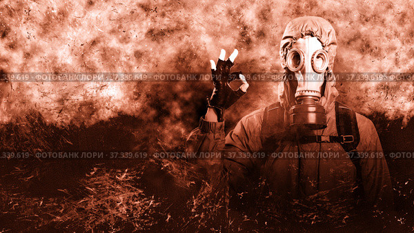 A shot of a man dressed in a gas mask, a hooded jacket, a backpack, shows a gesture of ok, looks into the camera. Poster on the background of grunge. Стоковое фото, фотограф Владимир Арсентьев / Фотобанк Лори
