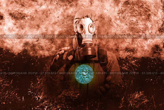A shot of a man dressed in a gas mask, a jacket with a hood, a backpack, holding his hands in front of him as if there was something in them, looking into the camera. poster on the background of grunge. Стоковое фото, фотограф Владимир Арсентьев / Фотобанк Лори