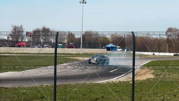 A sports car goes through a turn in a slide. Slow motion. Стоковое видео, видеограф Ярославский Максим / Фотобанк Лори