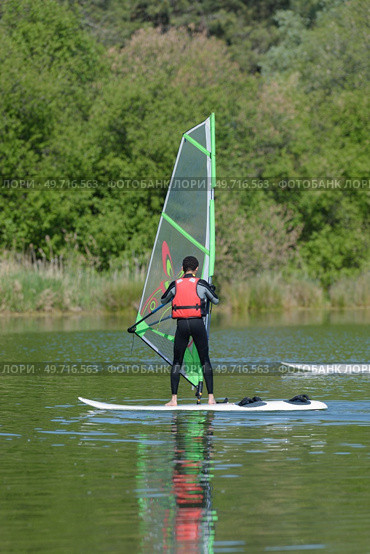 a windsurfer on the sea. Стоковое фото, агентство Ingram Publishing / Фотобанк Лори